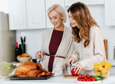 two women preparing thanksgiving dinner