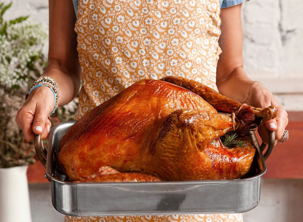 woman holding thanksgiving turkey