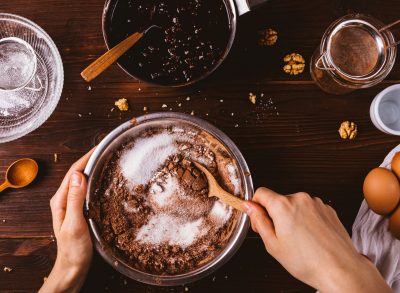woman mixing ingredients for chocolate cake