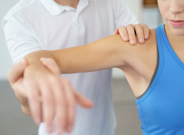 woman doing physical therapy for tennis elbow