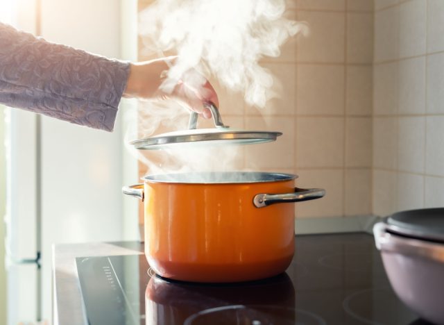 woman covering a pot