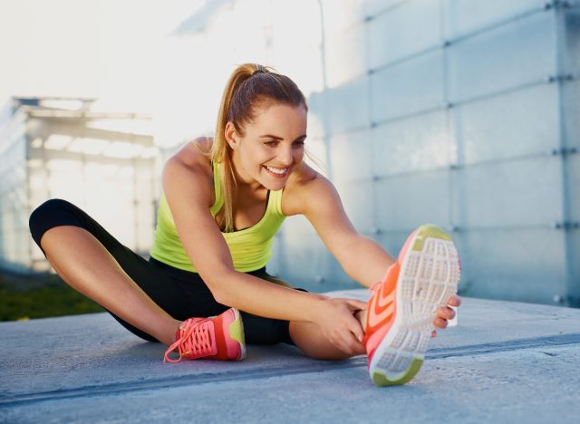 woman stretching outdoors