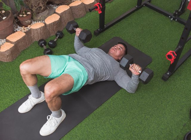 man doing bridge chest press exercise for one-month weight loss challenge