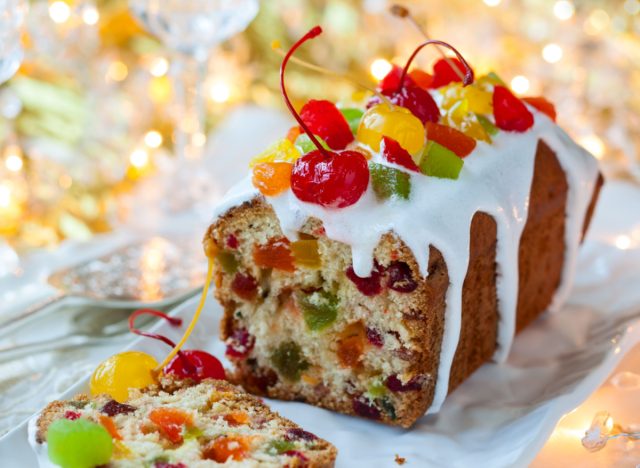 christmas fruitcake with sugar icing and candied fruits