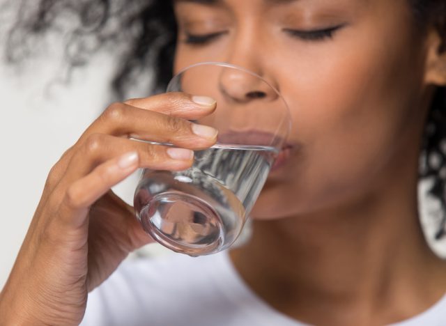 close-up woman drinking water