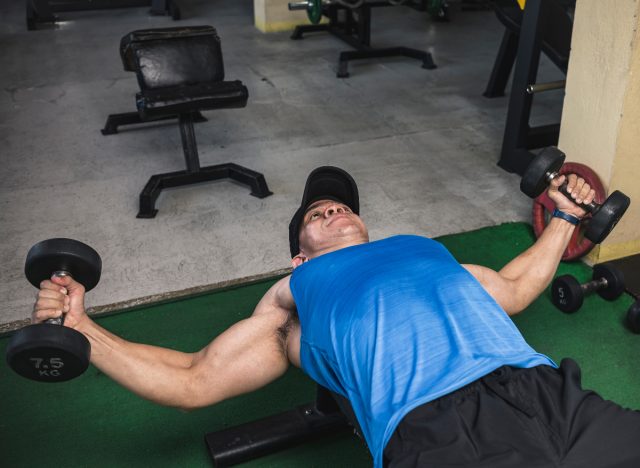 man doing dumbbell pec fly exercise