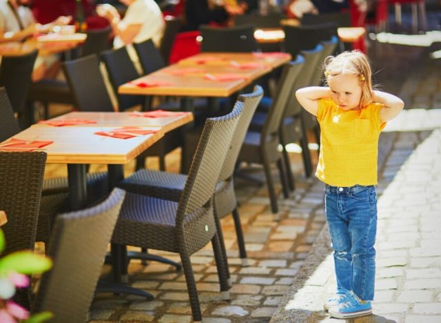 kid alone at restaurant