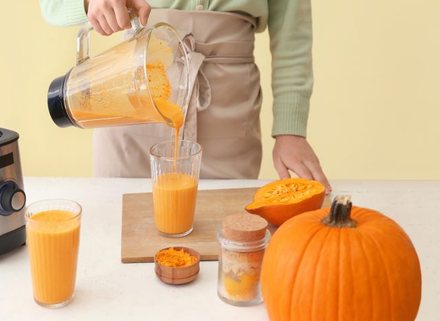 woman preparing seasonal winter fall smoothie