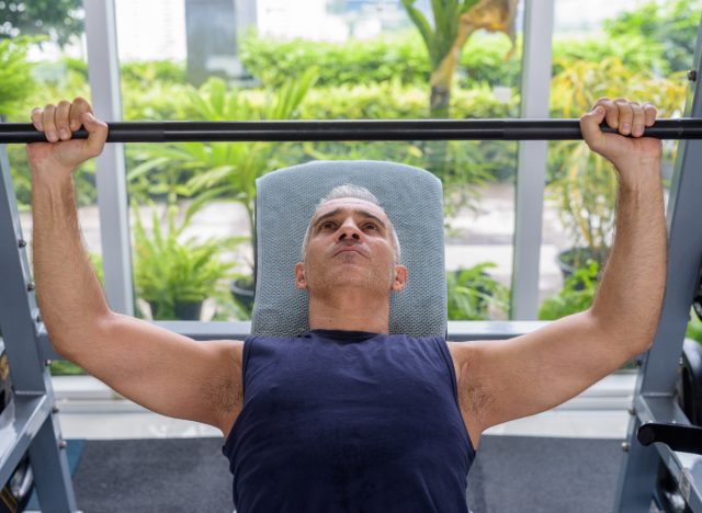 man doing bench presses