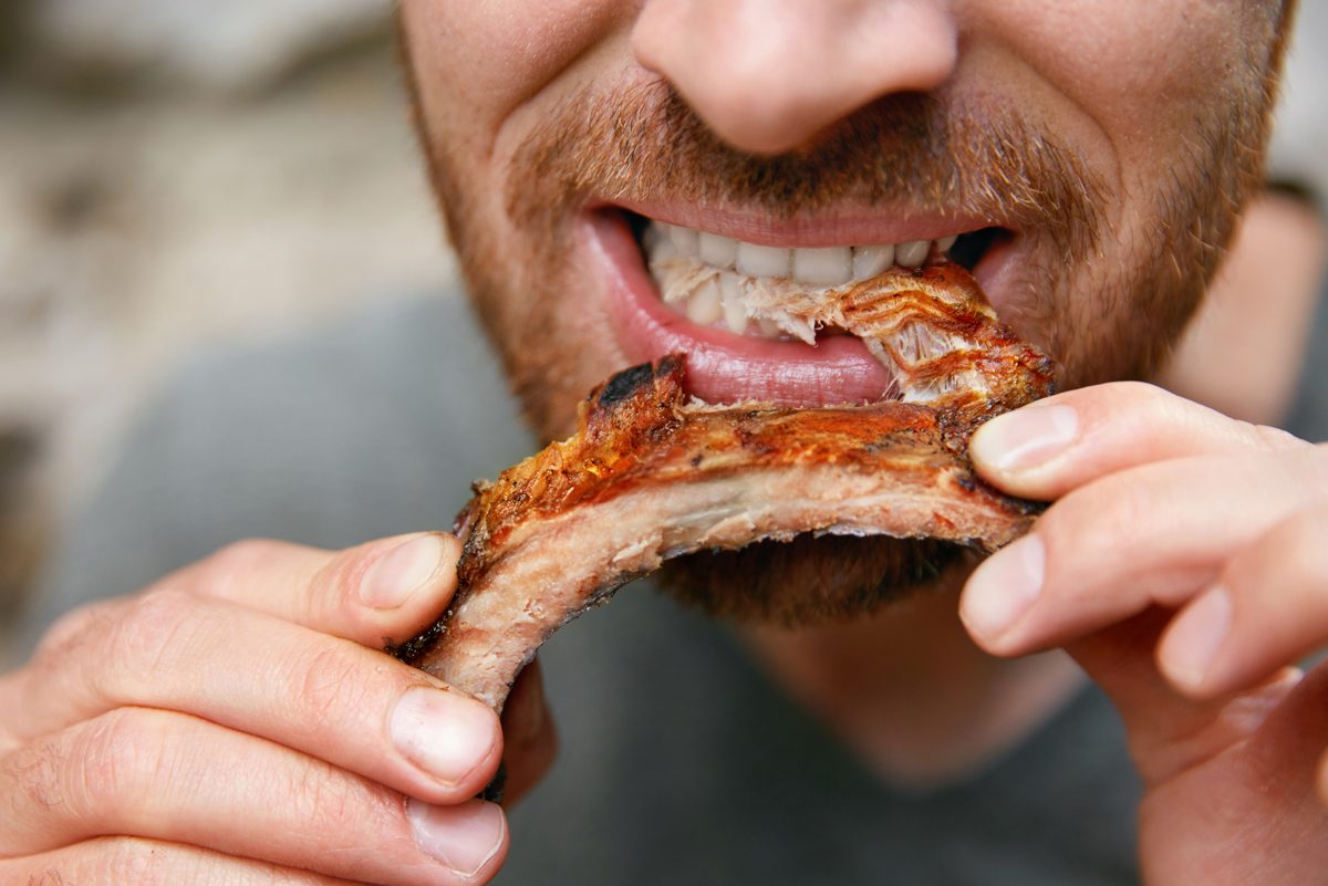 Man eating ribs