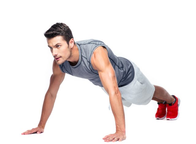 man doing best chest workout pushups for stronger, bigger pecs