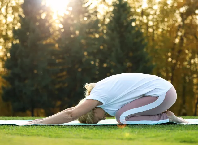 mature woman child's pose exercise