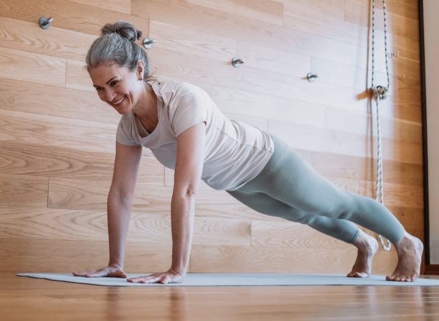 mature woman demonstrating pushups exercises to fight winter weight gain