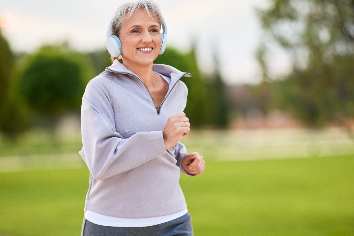 woman running outdoors, concept of how to increase stamina after 60