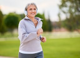 woman running outdoors, concept of how to increase stamina after 60