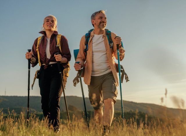 middle-aged couple hiking, signs you're in good shape at 50