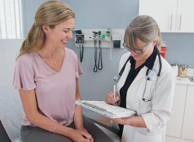 middle-aged woman having successful check-up, signs you're in good shape at 50