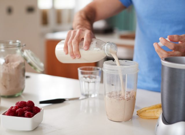 man preparing a protein shake concept of how to get rid of body flab