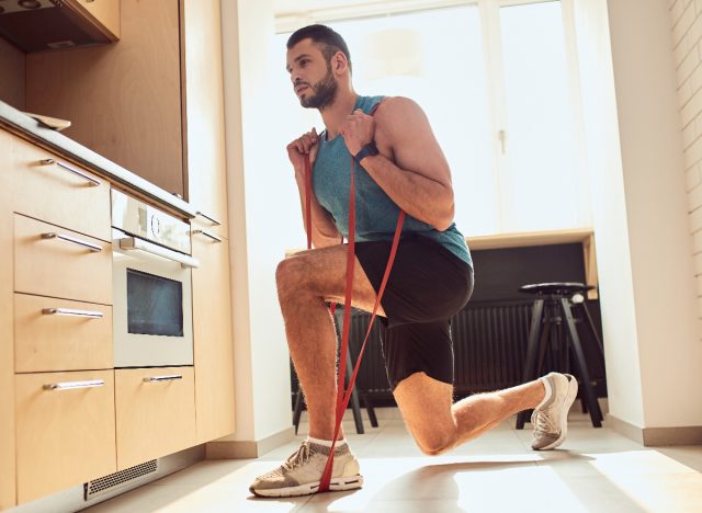 man demonstrating resistance band split squat exercises to get stronger as you age