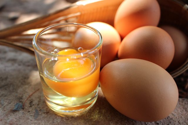 raw egg in a glass
