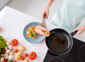 cooking a grilled salmon fillet and veggies