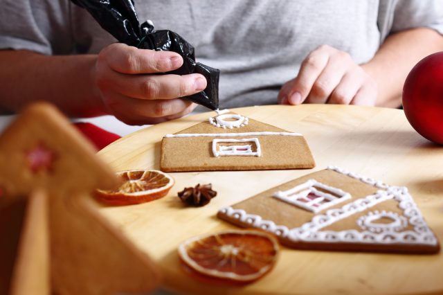 decorating the walls of a Christmas gingerbread house