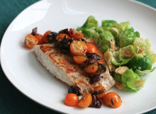 spicy sauteed fish with olives and cherry tomatoes