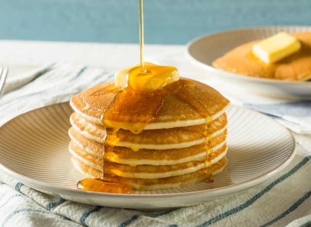 stack of pancakes with syrup and butter