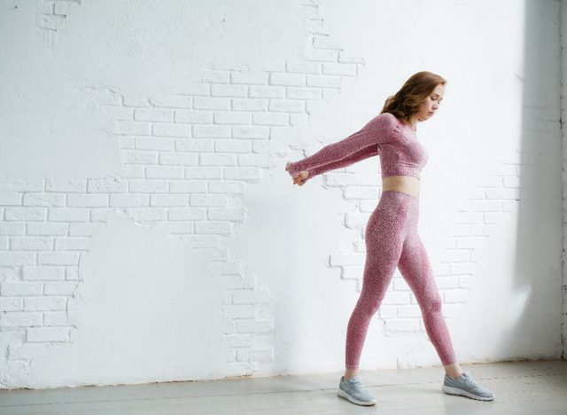 standing pec stretch to improve neck hump