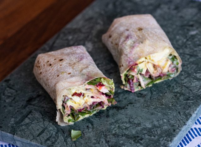 vegetarian wrap with beets, red cabbage, arugula, and hummus