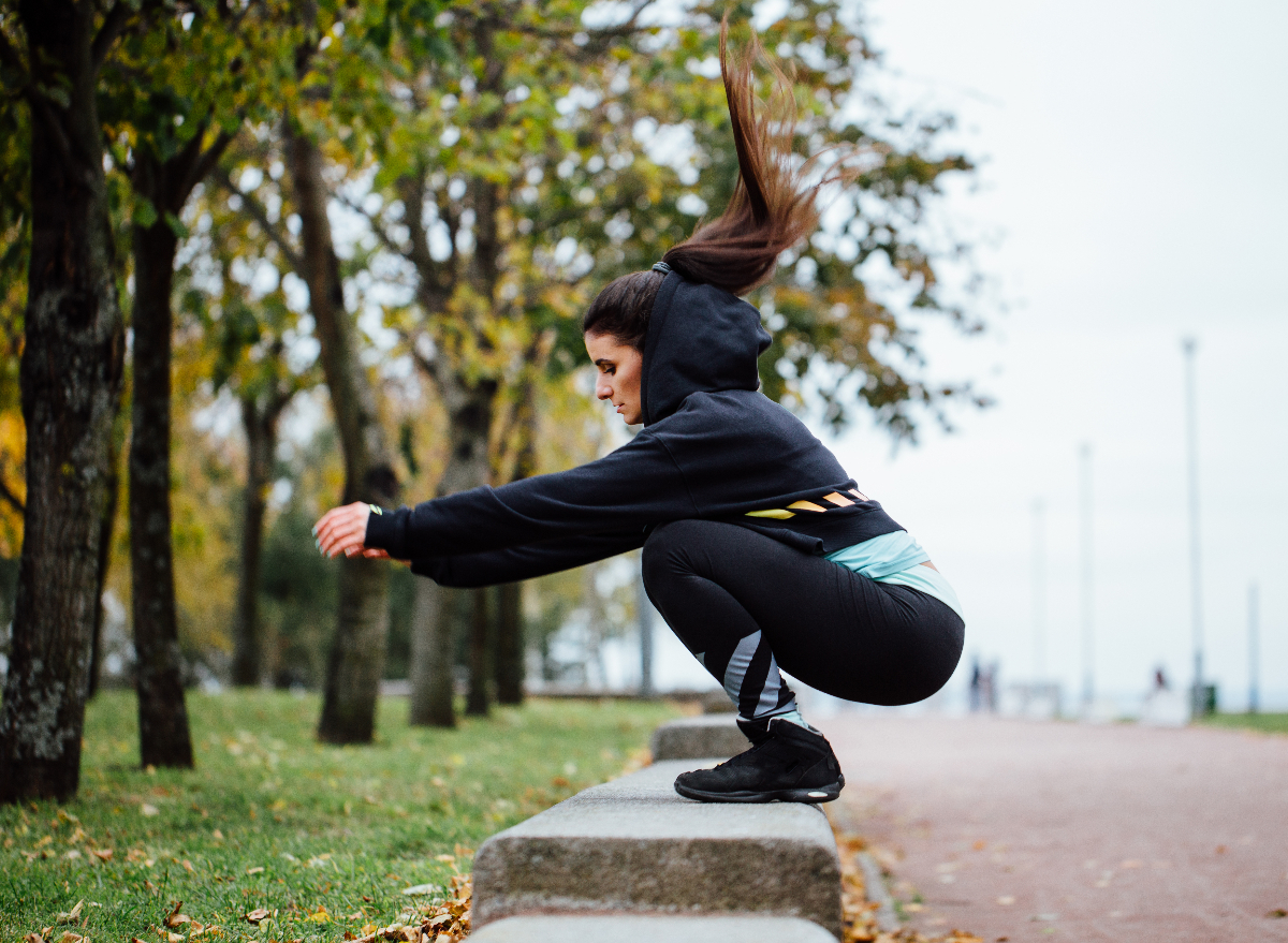 woman doing box jumps outdoors, weight loss for women concept