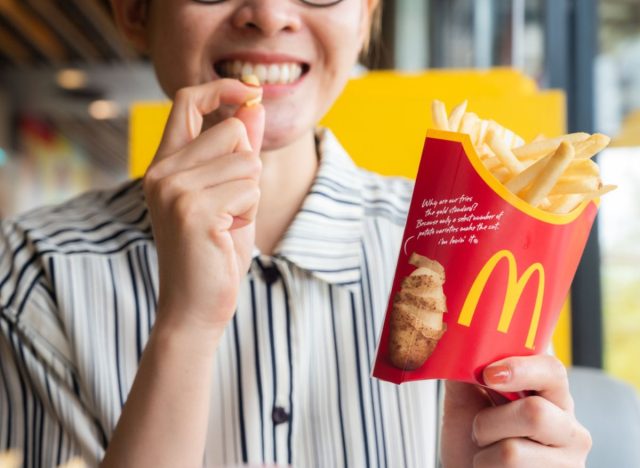 woman eating mcdonalds fries