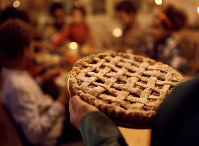 woman serving pie