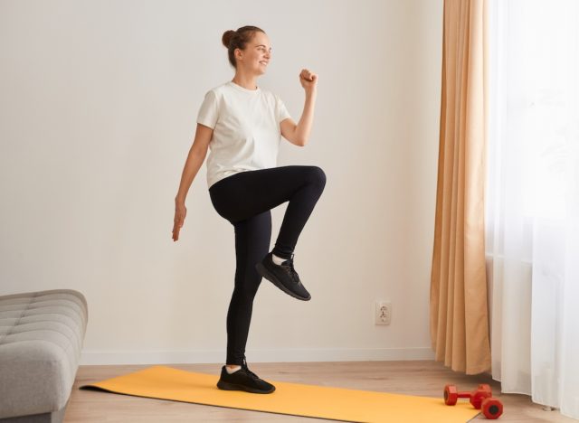 woman walking in place for easy cardio exercises at home