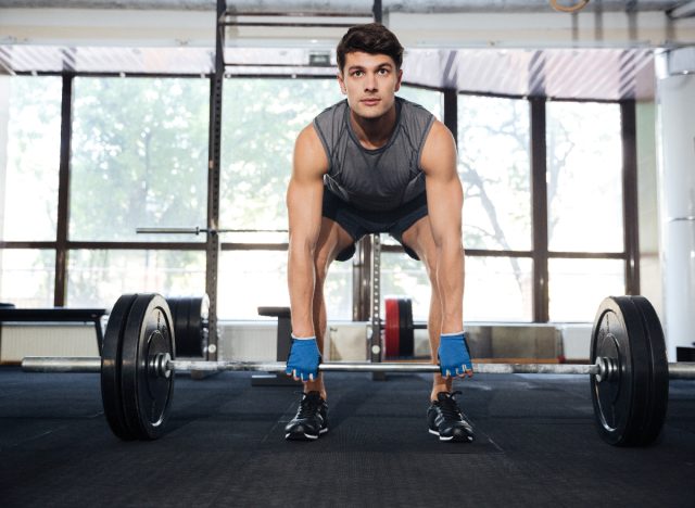 man doing barbell deadlifts