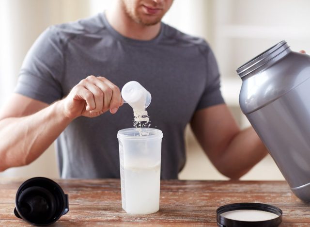 man making protein shake, eating mistakes for building muscle concept