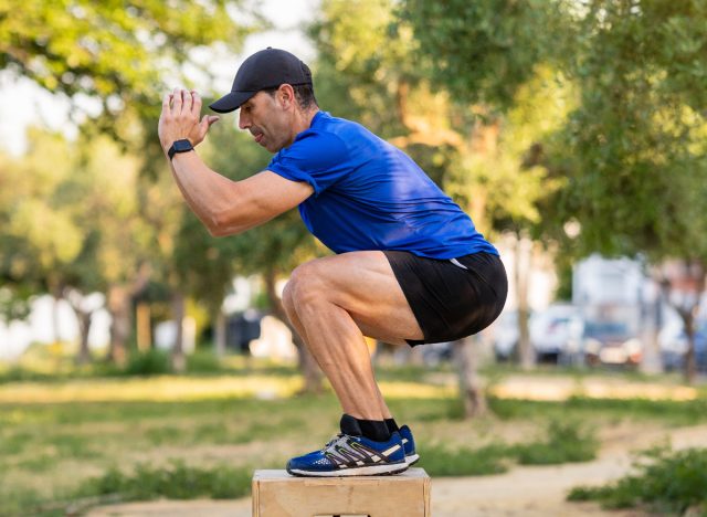 mature man box jumping outdoors, exercise to avoid burning belly fat