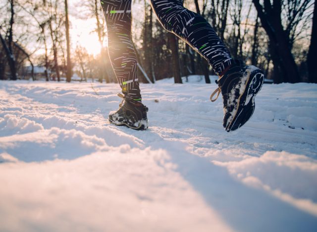 close-up sneakers winter walking workout in snow