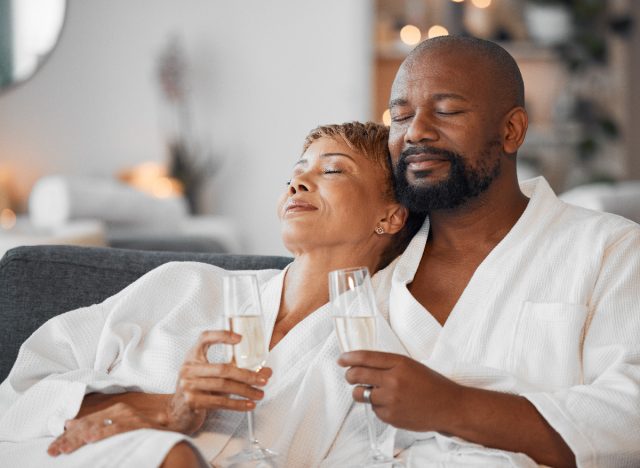 couple on couch with champagne home spa date