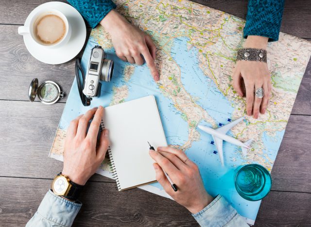 couple planning road trip map date night ideas