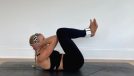 trainer demonstrating exercises to avoid during pregnancy by doing crunches on mat