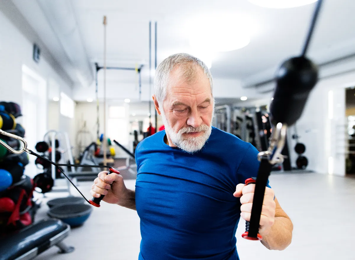 fit senior man demonstrating resistance band exercises to tone your body after 60