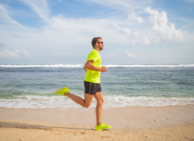 fitness man beach run, dangers of running for exercise concept