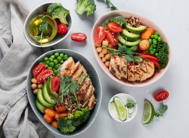 healthy chicken bowls with vegetables, chickpeas, and quinoa