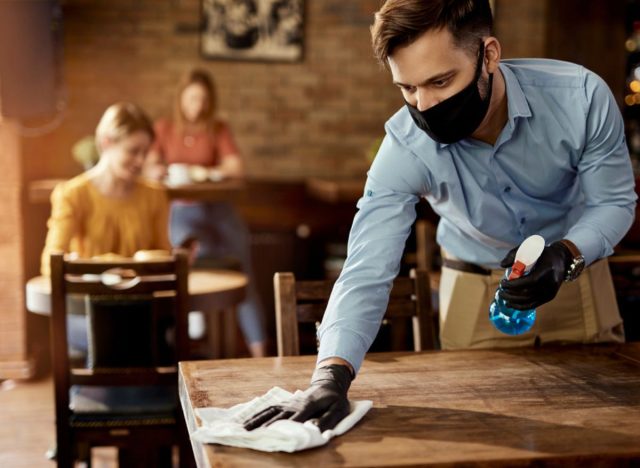 man cleaning restaurant