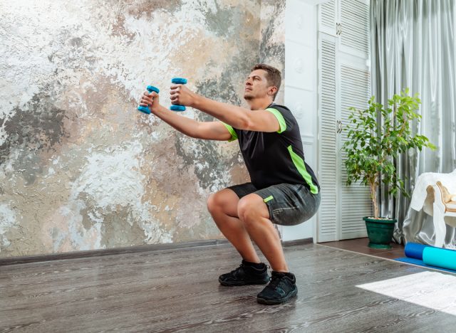 man doing dumbbell squats to slow muscle aging after 40