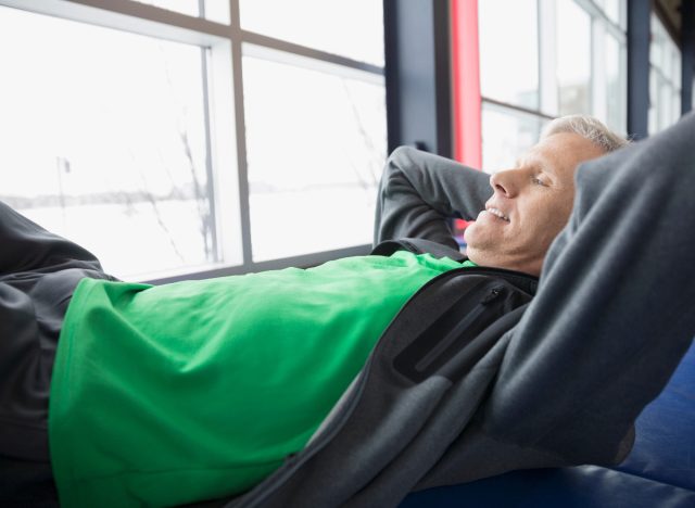 mature man doing sit-ups