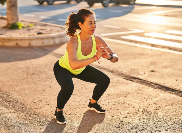 mature woman doing bodyweight squats, demonstrating how to improve muscular endurance