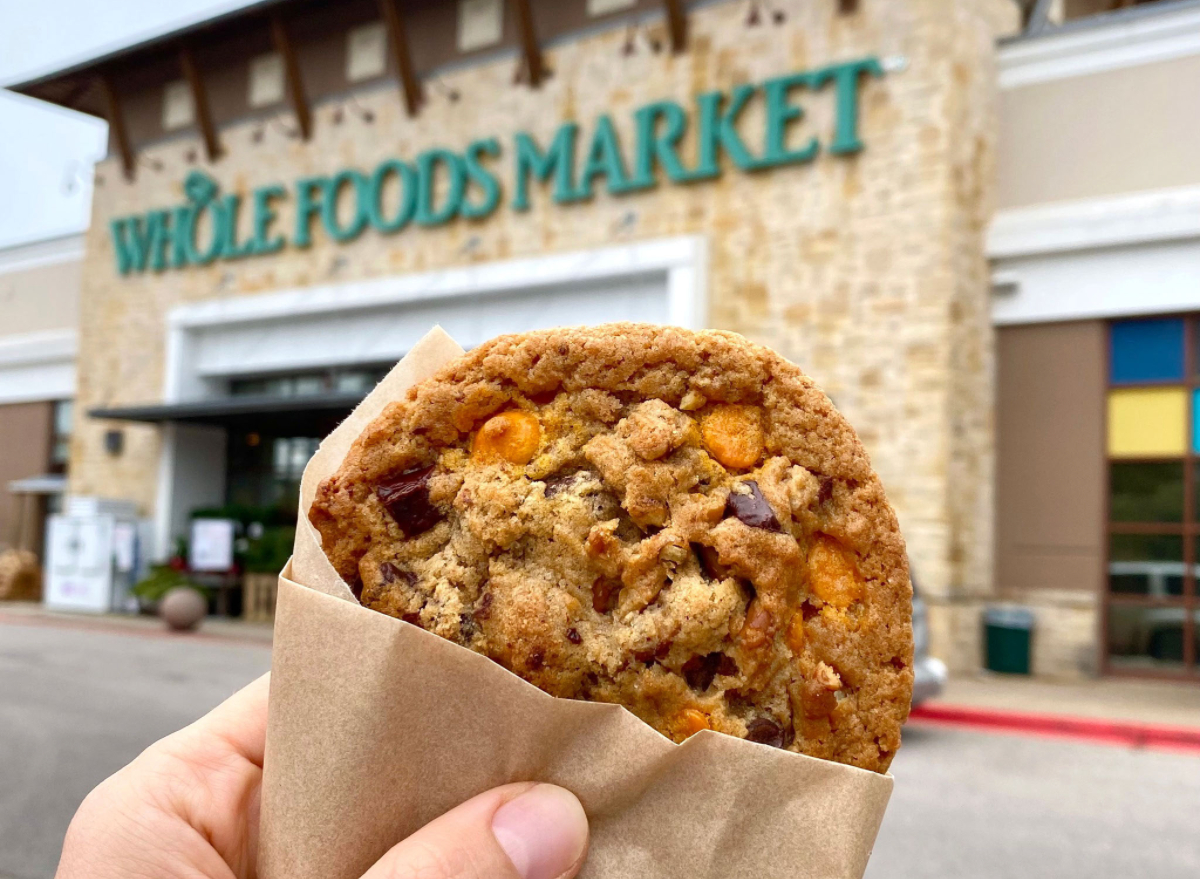 person holding whole foods brown butter butterscotch pretzel cookie