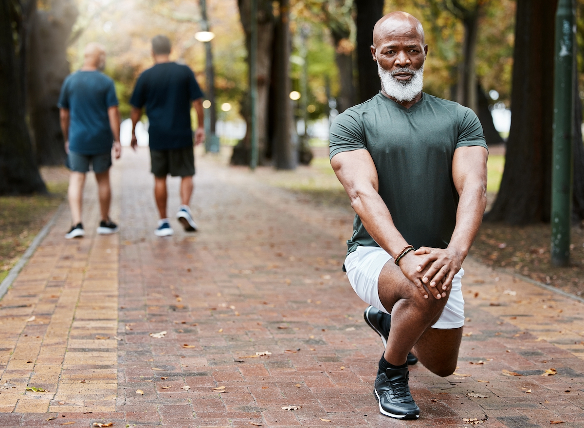 senior man in park doing lunges, demonstrating exercise mistakes you're too old to make after 50